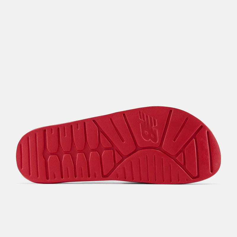 New Balance DynaSoft 200v2 VRSTY outsole in vibrant red with grooved traction design and embossed logo, sole/bottom view.