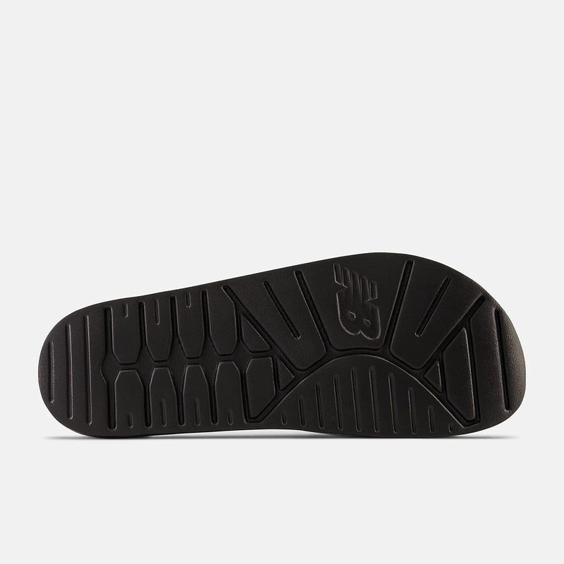 New Balance DynaSoft 200v2 shoe outsole in black, featuring durable rubber with traction grooves and embossed logo design.