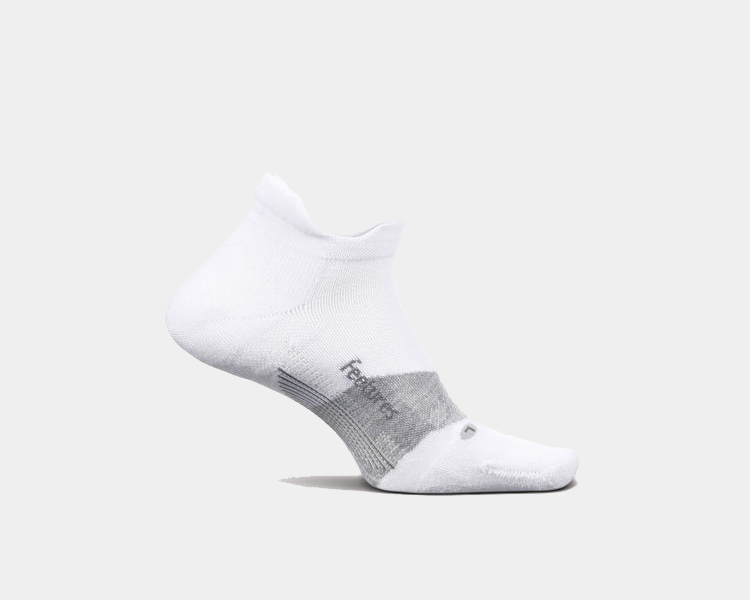 Feetures Elite Golf Max Cushion No Show Tab socks, white with gray accents, side view showing arch support and ribbed cuff.