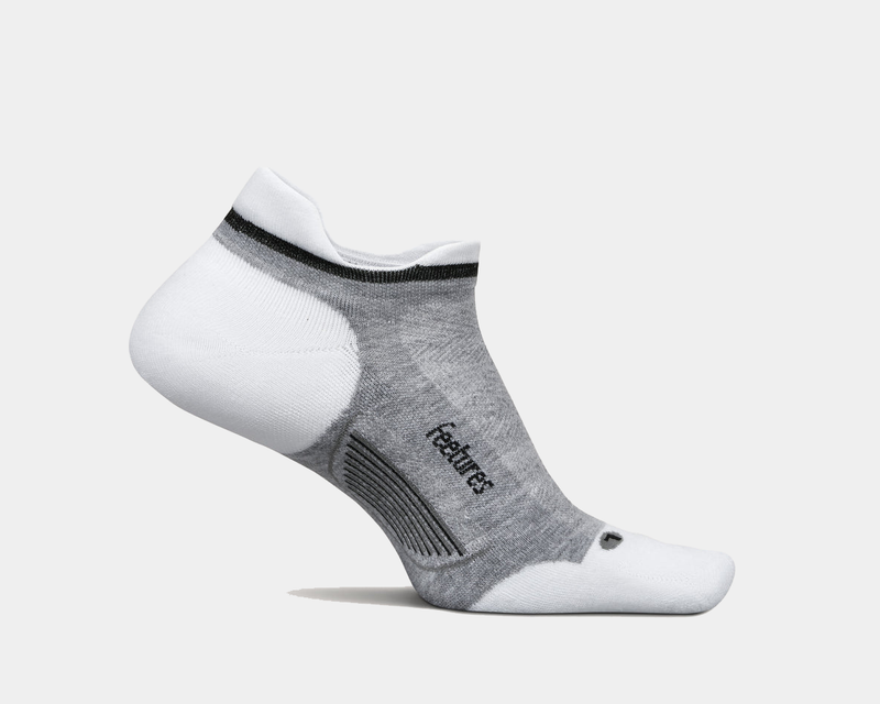 Feetures Elite Golf Max Cushion No Show Tab socks in gray and white with enhanced cushioning, side view.