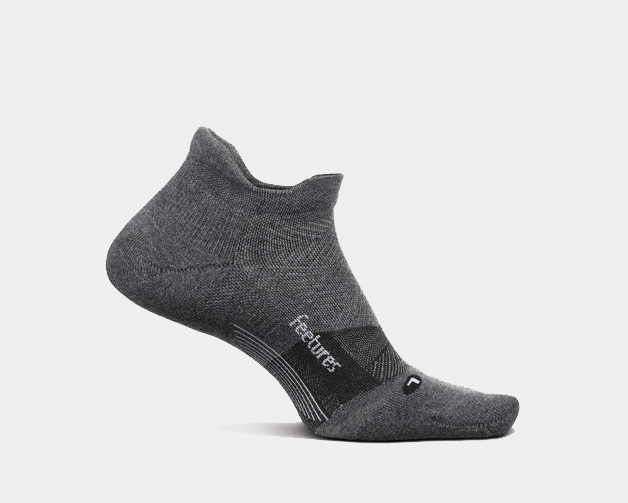 Feetures Elite Golf Max Cushion No Show Tab socks in dark gray with enhanced cushioning and no-show design, side view.