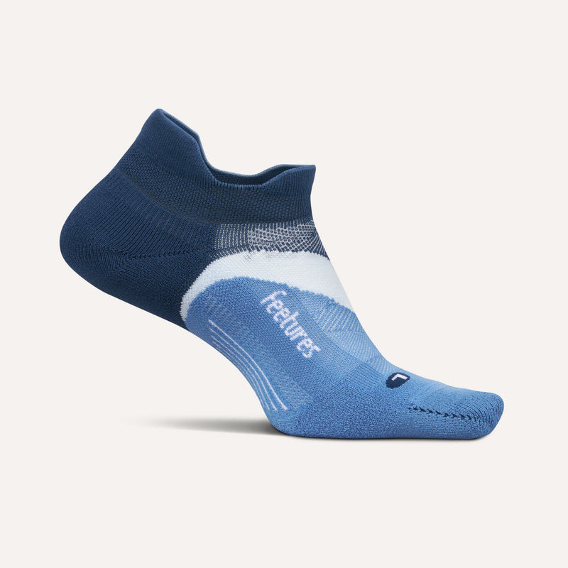 Feetures Elite Light Cushion No Show Tab socks in blue with arch support and moisture-wicking fabric, side view.