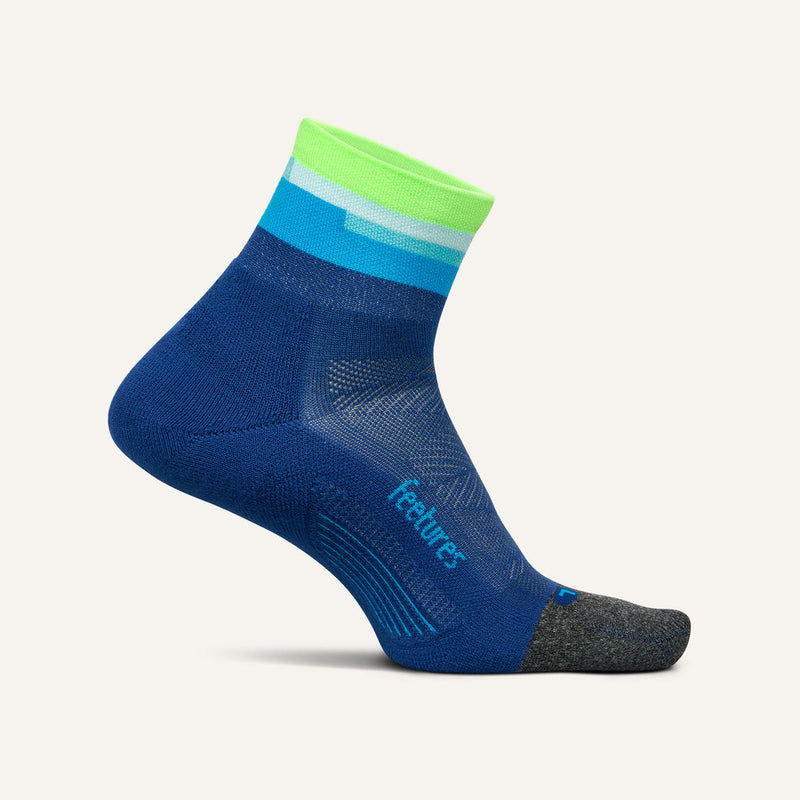 Feetures Elite Light Cushion Quarter socks in blue and green with targeted compression and seamless toe, side view.