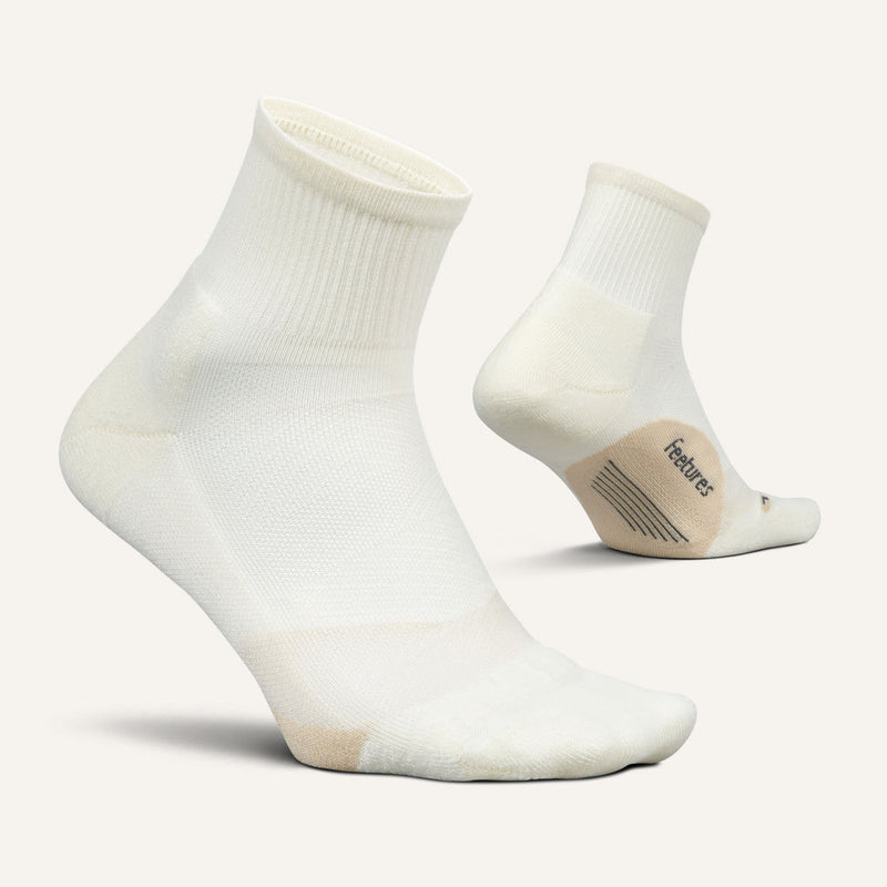 Feetures Elite Light Cushion Quarter socks in white, featuring ribbed cuff and reinforced heel and toe, side view.