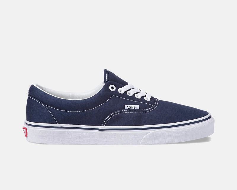 Vans Era Core sneakers in navy blue canvas with white stitching and laces, side view.