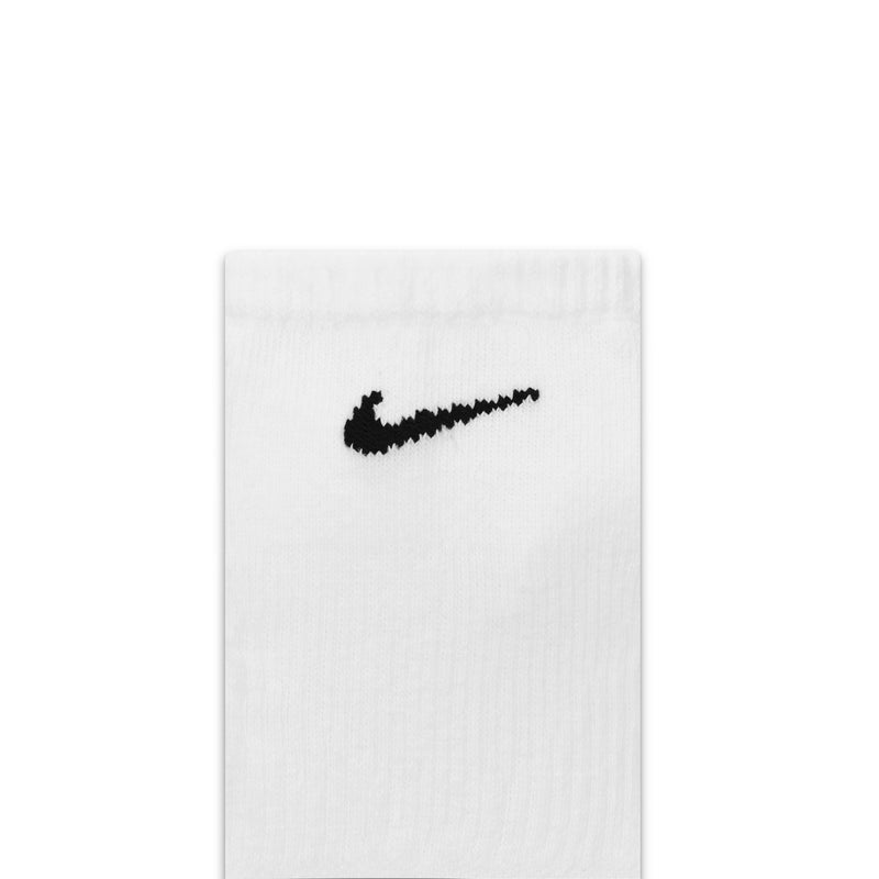 Nike Everyday Plus Cushioned No Show Socks in white with black embroidered logo detail, close-up view.