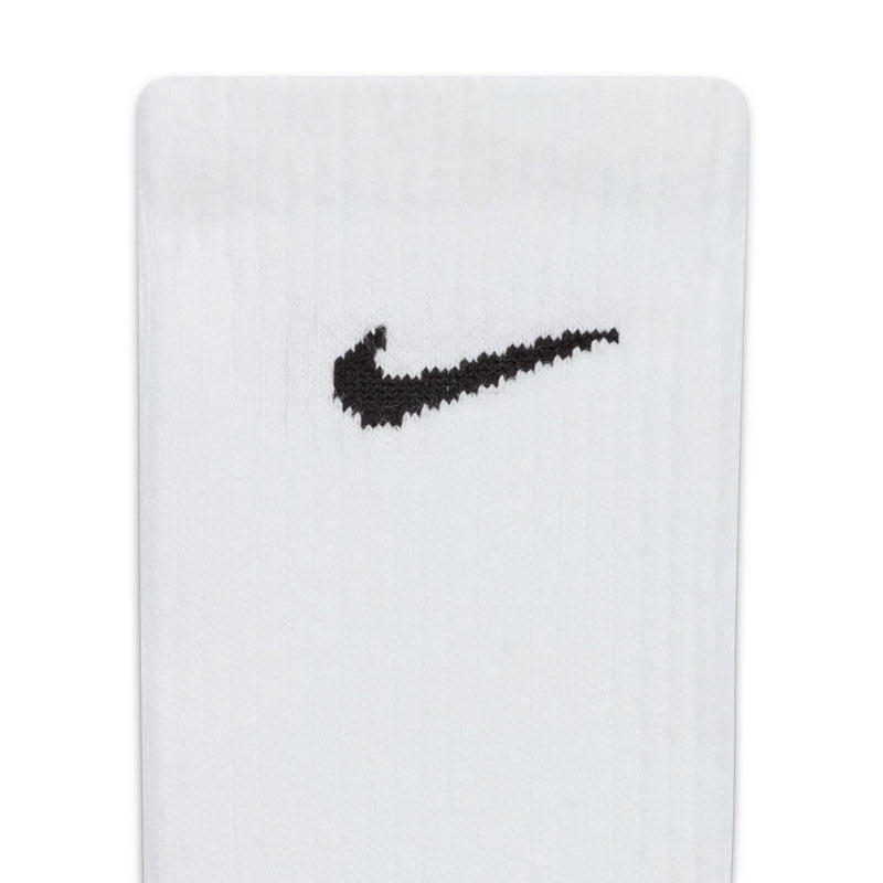 Nike Everyday Plus Cushioned Training Crew Socks in white with black Nike Swoosh logo, close-up view of ribbed upper.