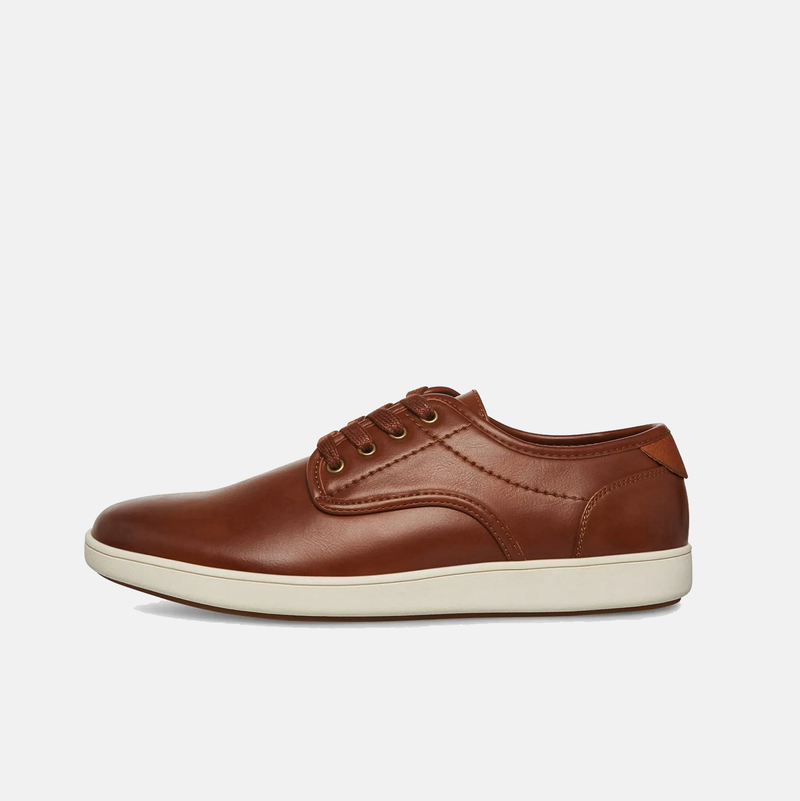 Steve Madden Fenta Leather casual shoes in brown leather with stitched detailing and white rubber soles, side view.