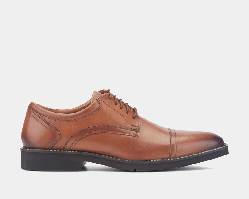 Rockport Findlay Lace-up Almond Toe Oxfords in brown leather with contrast stitching and a low black heel, side view.