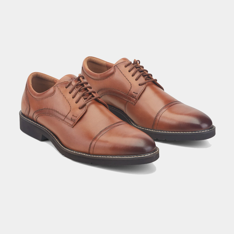 Rockport Findlay Lace-up Almond Toe Oxfords in polished brown leather with cap toe detail and contrast stitching, angled front view.
