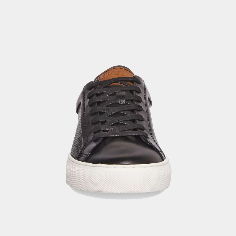 Steve Madden Finneas sneakers in black leather with a textured upper, white rubber sole, and black laces, front view.