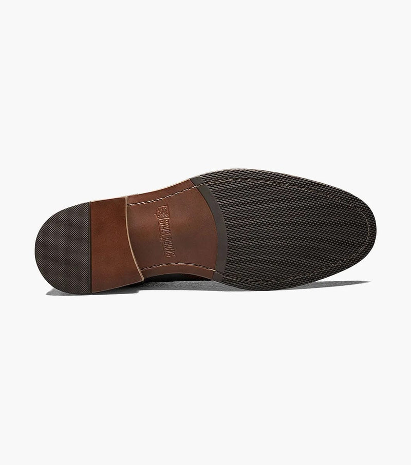 Stacy Adams Finnegan dress shoe outsole featuring textured grip and leather accents in brown, sole view.