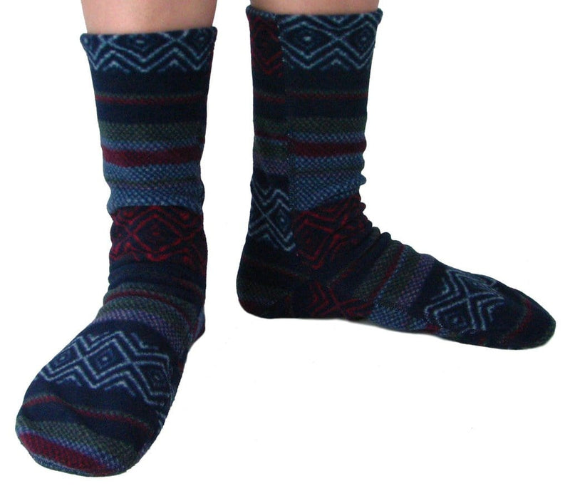 Polar Feet Fleece Socks with multicolored geometric patterns, soft and warm mid-calf design, worn view showcasing fit.