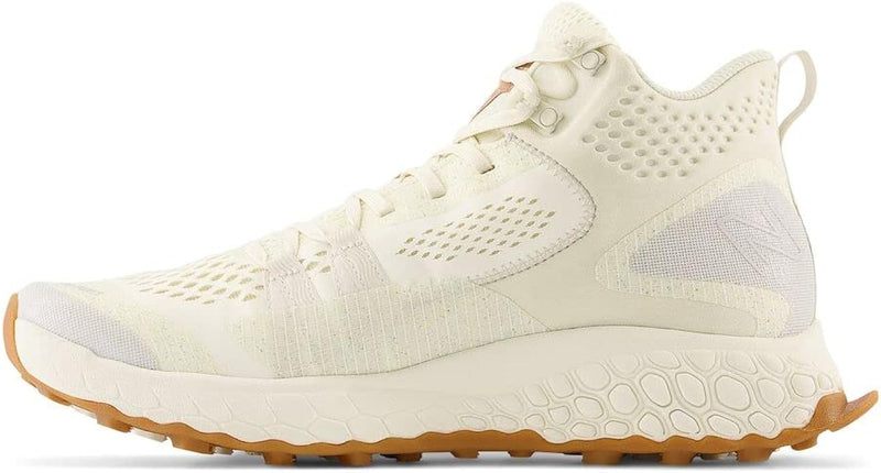 New Balance Foam X Hierro Mid GTX hiking shoes in off-white with GORE-TEX upper and Vibram outsole, side view.