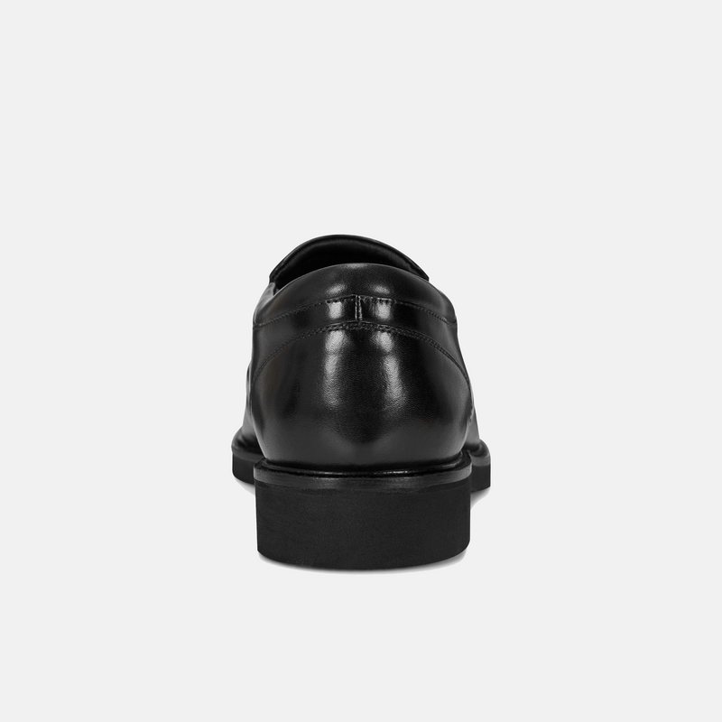 Rockport Folton Almond Toe Slip On dress shoe in black leather with polished finish, back view showing heel and sole design.