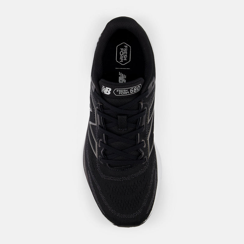 New Balance Fresh Foam 680v8 running shoes, black mesh upper with lace-up closure and branding on tongue, top view.