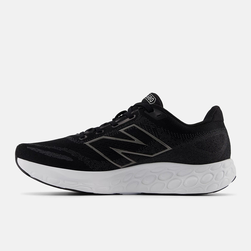 New Balance Fresh Foam 680v8 running shoes in black with mesh upper and cushioned white midsole, side view.