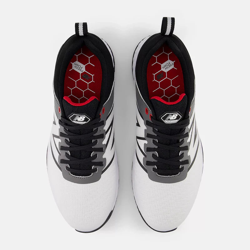 New Balance Golf Fresh Foam Contend v2 golf shoes in white and black with hexagonal-patterned red insole and mesh upper, top view.