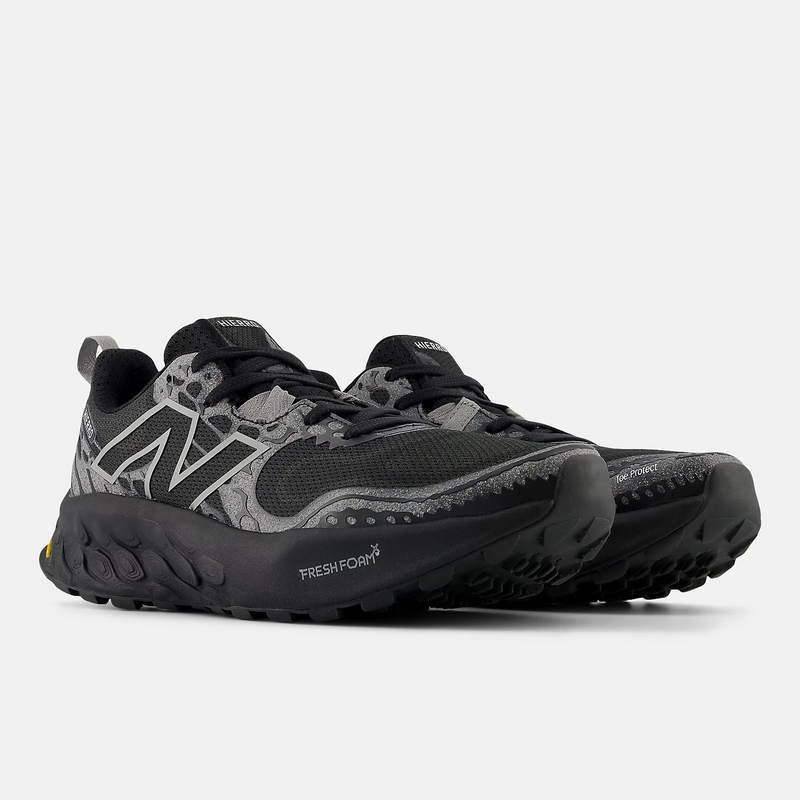 New Balance Fresh Foam Hierro v8 trail running shoes in black and gray with mesh upper and rugged outsole, front angle view.