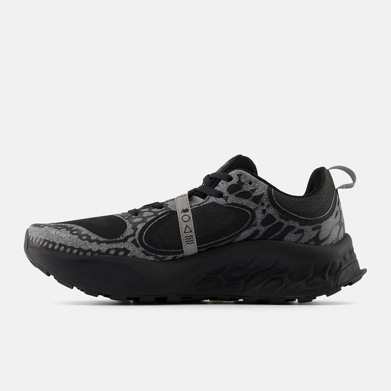 New Balance Fresh Foam Hierro v8 trail running shoes in black with silver accents, mesh upper and rugged outsole, side view.
