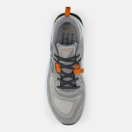 New Balance Fresh Foam Hierro v8 trail running shoes top view showing gray mesh upper with orange accents and secure lace system.