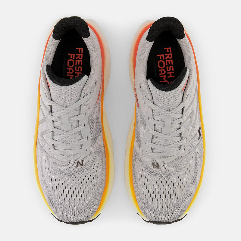 New Balance Fresh Foam More v4 running shoes in gray with orange and yellow accents, mesh upper and lace system, top view.