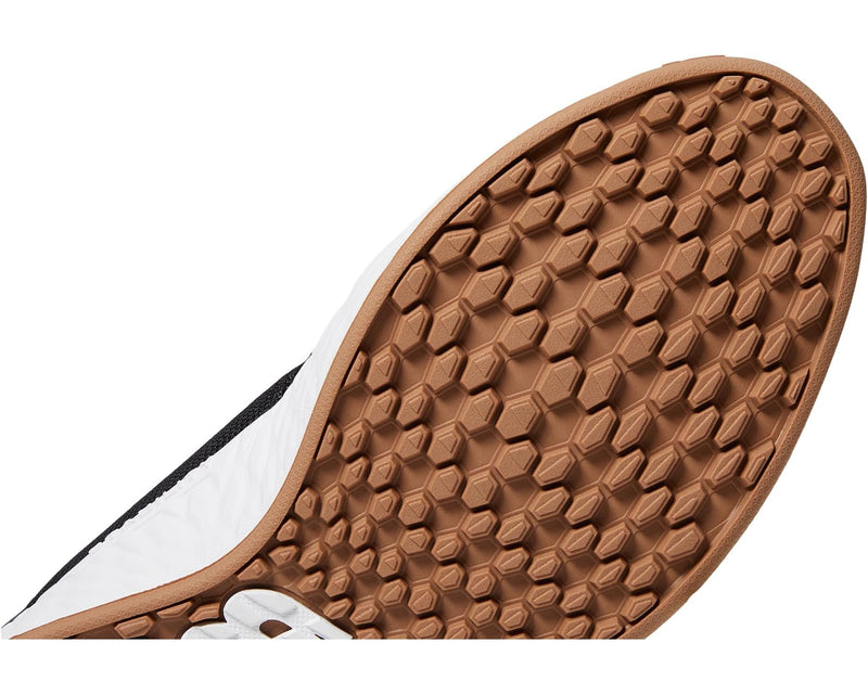 New Balance Golf Fresh Foam ROAV Golf shoe outsole featuring brown rubber with hexagonal traction pattern.