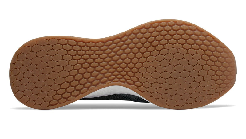New Balance Fresh Foam Roav Tee Shirt running shoes outsole showing hexagonal tread pattern in brown rubber.
