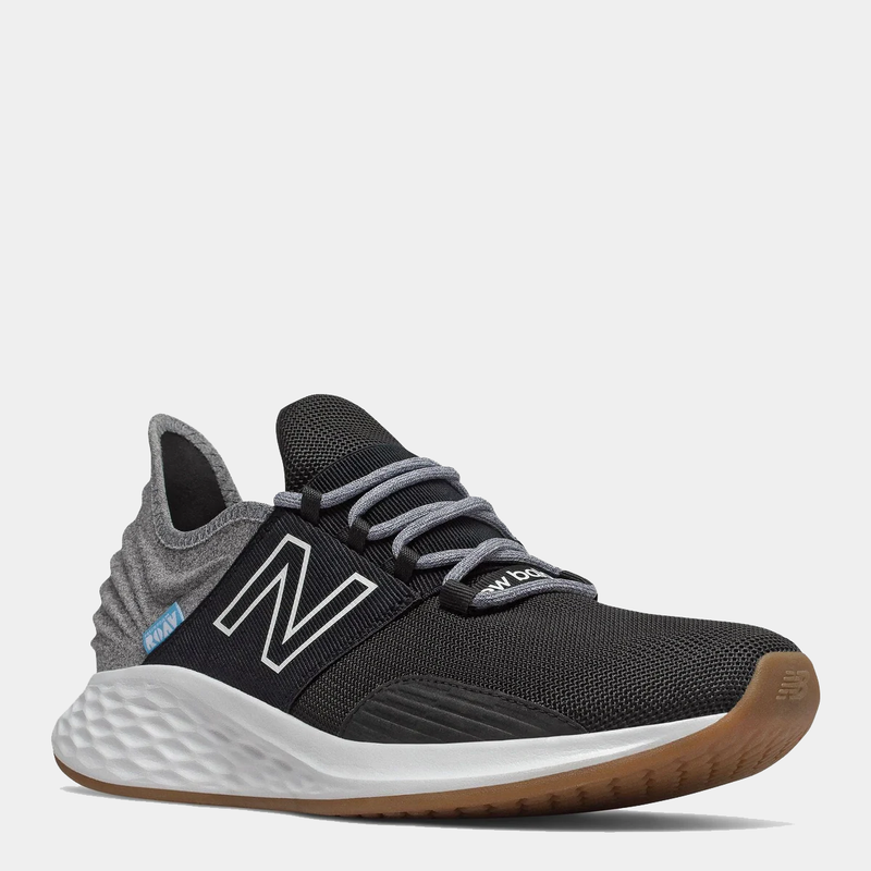 New Balance Fresh Foam Roav Tee Shirt running shoes in black and gray with mesh upper, cushioned midsole, and gum outsole, front angle view.