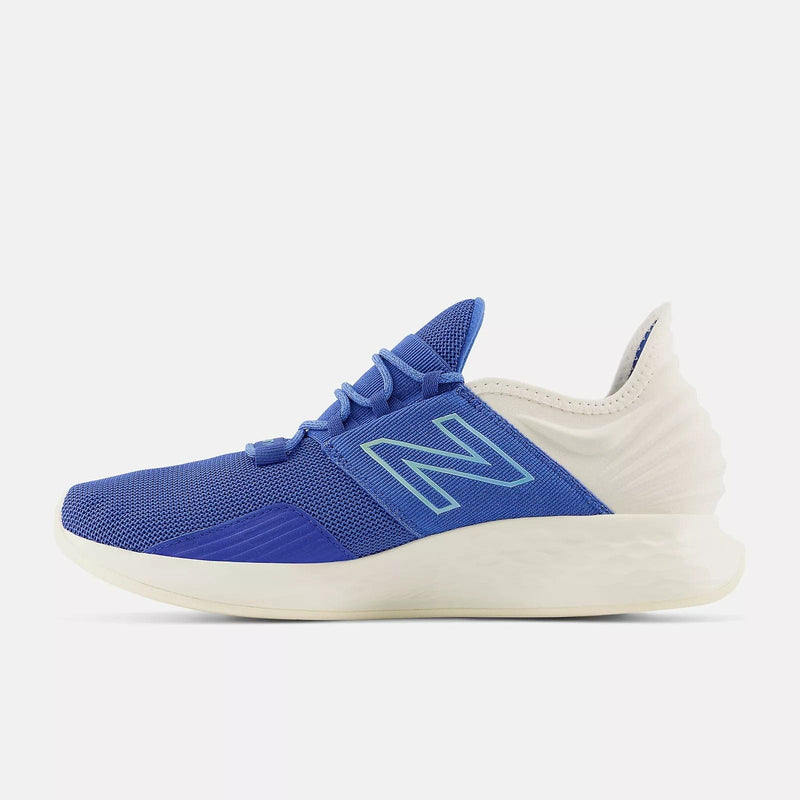 New Balance Fresh Foam Roav running shoes in blue with a mesh upper, white midsole, and flared heel design, side view.