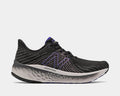 New Balance Fresh Foam Vongo v5 running shoes in black with purple accents, mesh upper, and cushioned Fresh Foam midsole, side view.