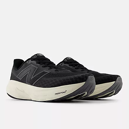 New Balance Fresh Foam X 1080v14 running shoes in black with mesh upper, cushioned white midsole, and textured outsole, front-side view.