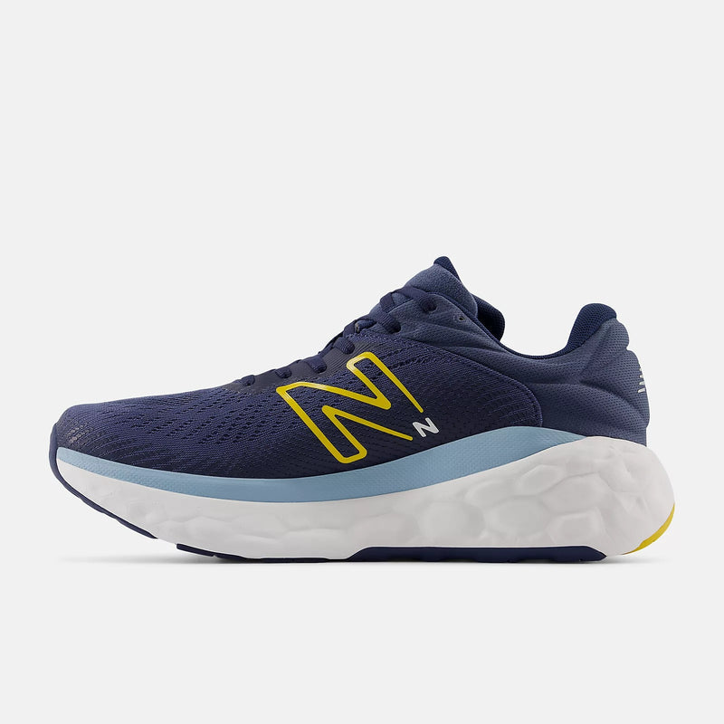 New Balance Fresh Foam X 840F running shoes in navy blue with yellow logo, mesh upper, and cushioned foam midsole, side view.