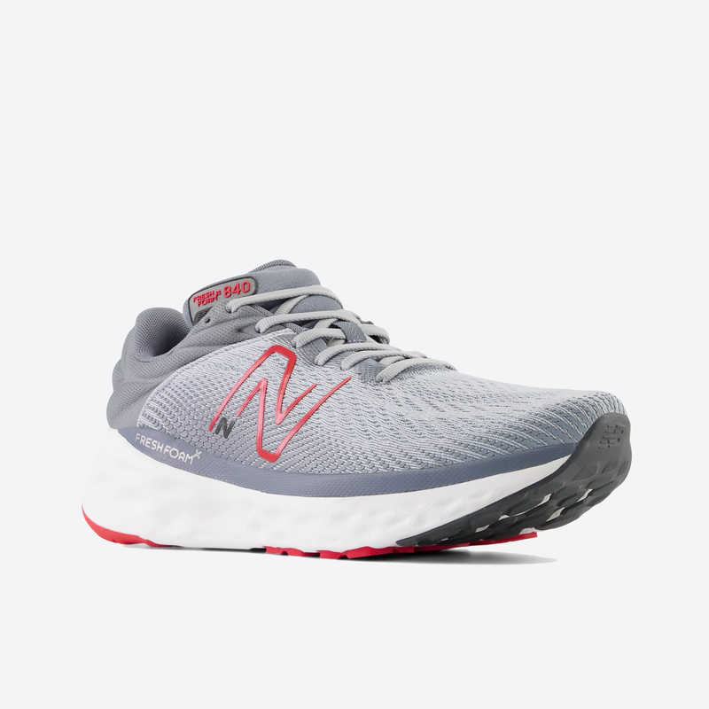 New Balance Fresh Foam X 840v1 running shoes in gray with pink accents, breathable mesh upper, and cushioned midsole, angled front view.