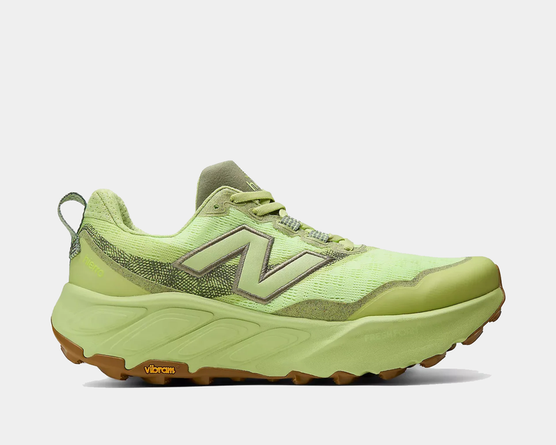 New Balance Fresh Foam X Hierro v9 trail running shoes in light green and olive with Vibram outsole and mesh upper, side view.