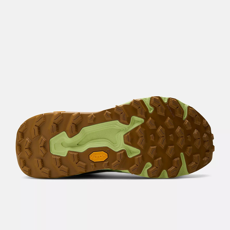 New Balance Fresh Foam X Hierro v9 trail running shoes outsole with Vibram grip and rugged lug pattern in brown and green, sole view.
