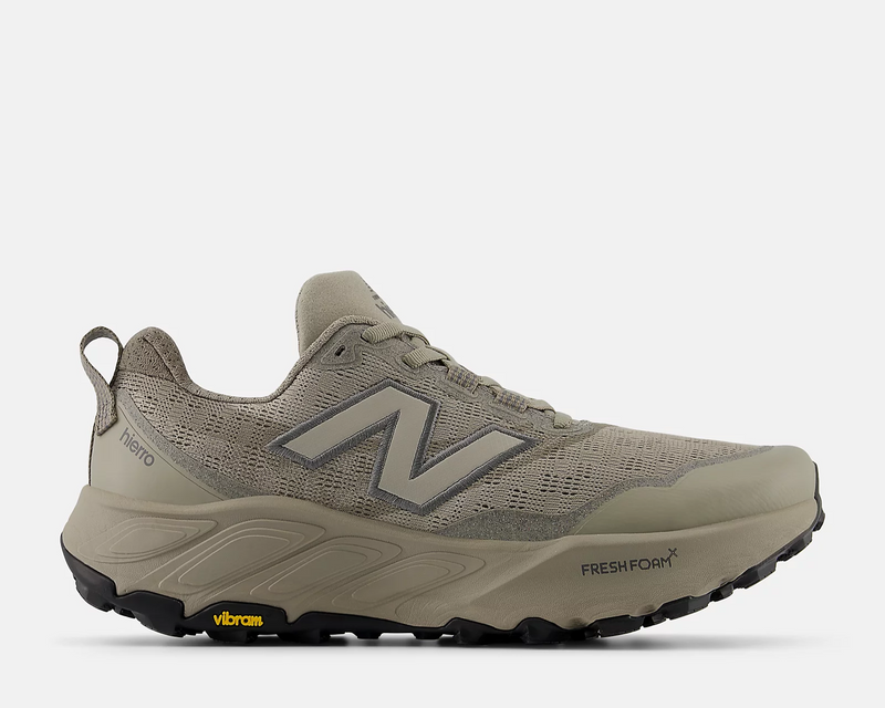 New Balance Fresh Foam X Hierro v9 trail running shoes in beige with mesh upper, Fresh Foam midsole, and Vibram outsole, side view.