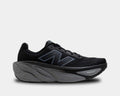 New Balance Fresh Foam X More v5 running shoes in black with a plush midsole and lightweight mesh upper, side view.