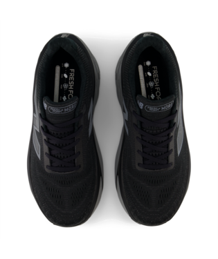 New Balance Fresh Foam X More v5 running shoes in black featuring breathable mesh upper and cushioned insole, top view.