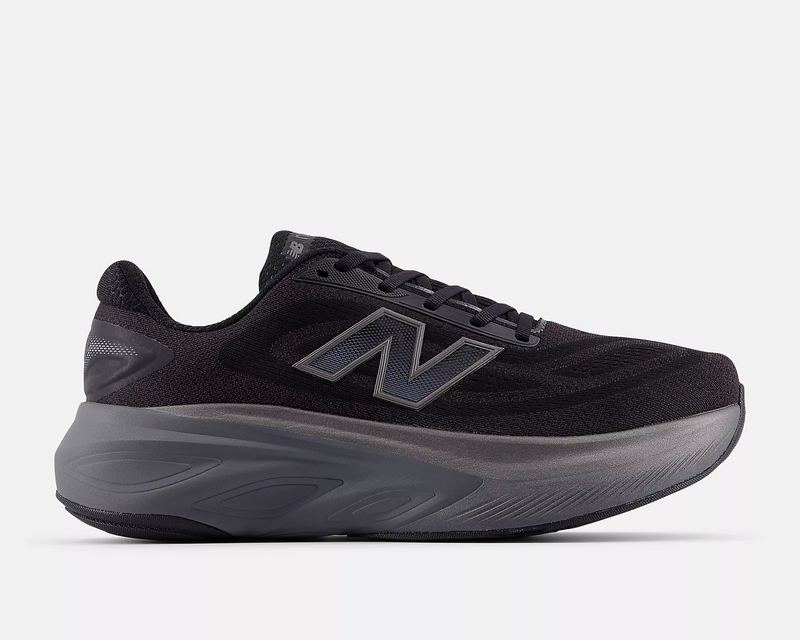 New Balance Fresh Foam X More v6 running shoes in black with a breathable mesh upper, oversized gray cushioned midsole, and side view.