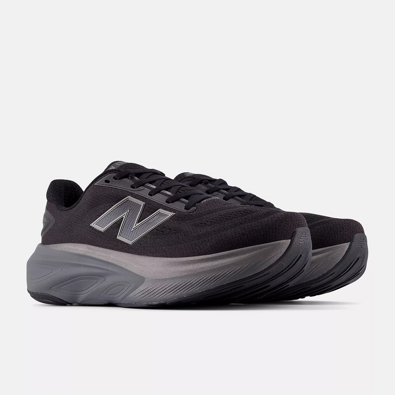 New Balance Fresh Foam X More v6 running shoes in black and gray with cushioned midsoles and mesh uppers, front-side angle.