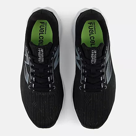 New Balance FuelCell Propel v5 running shoes in black with green inner lining, striped mesh upper, and lace-up closure, top view.