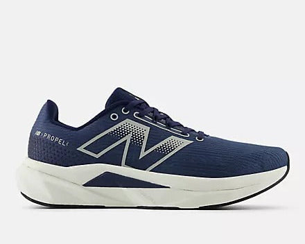 New Balance FuelCell Propel v5 running shoes in navy blue with white accents featuring a breathable mesh upper and cushioned midsole, side view.