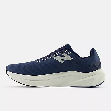 New Balance FuelCell Propel v5 running shoes in navy blue with silver logo, breathable mesh upper, and cushioned midsole, side view.