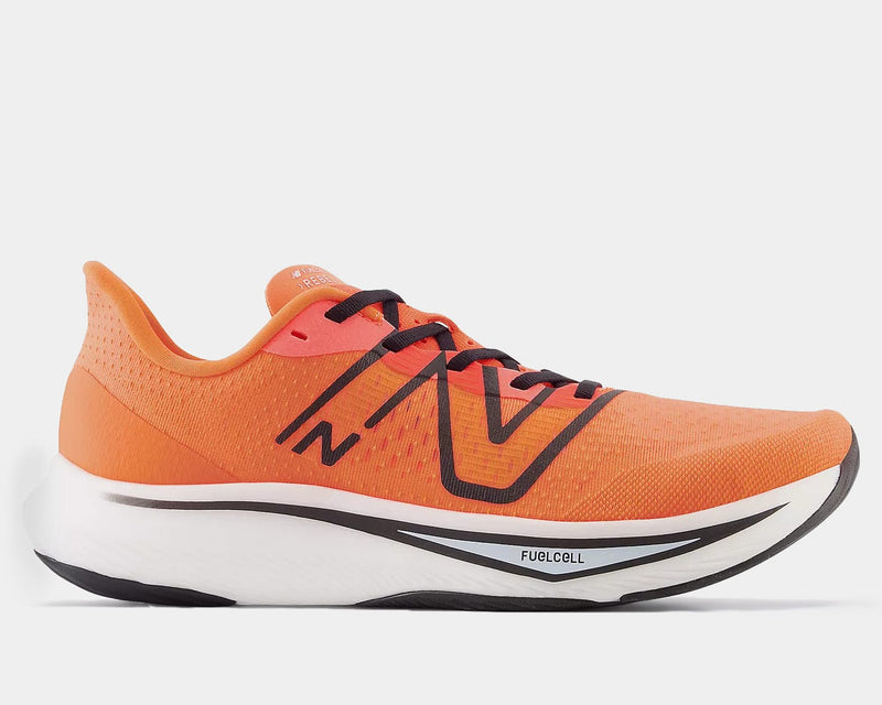 New Balance FuelCell Rebel v3 running shoes in vibrant orange with breathable mesh upper, black accents, and cushioned white midsole, side view.