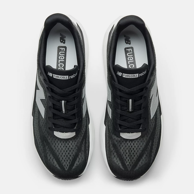 New Balance FuelCell Rebel v5 running shoes in black and gray with mesh upper and lace-up design, top view.