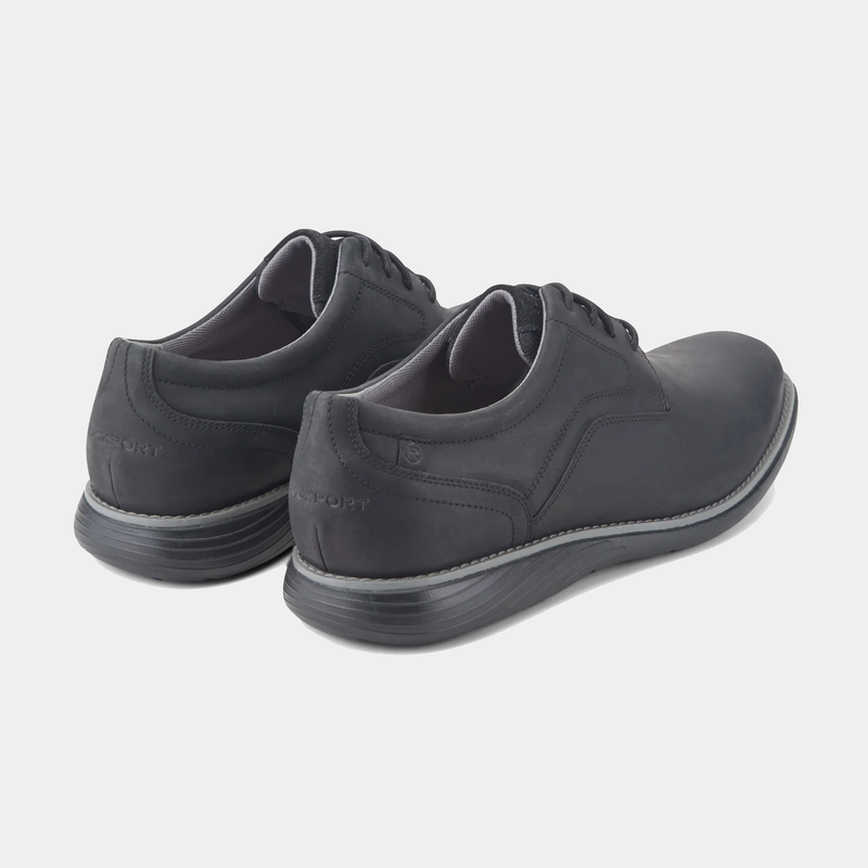 Rockport Garett Plain Toe shoes in black leather with embossed branding and cushioned sole, back angled view.