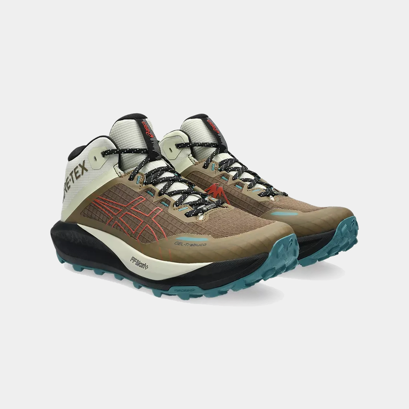 Asics Gel Trabuco 13 MT GTX trail running shoes in tan, white, and teal with GORE-TEX upper and rugged sole, angled front view.