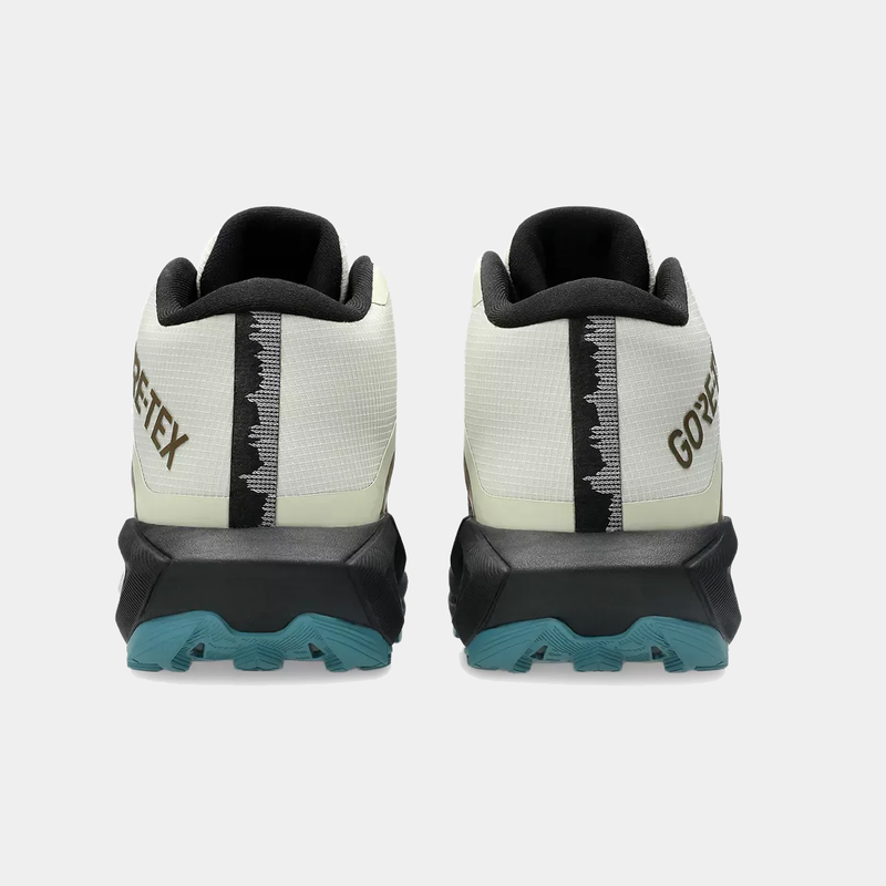 Asics Gel Trabuco 13 MT GTX trail running shoes back view featuring Gore-Tex upper, light beige and black design, and teal outsole.