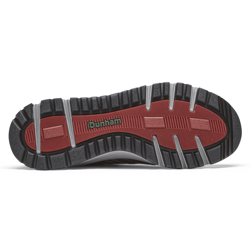Dunham Glastonbury Mid Waterproof boots outsole in black rubber with red accents and deep tread grooves, bottom view.